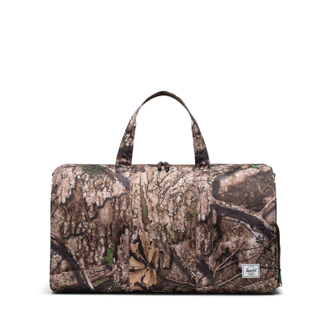 Herschel x Realtree APX™ Novel™ | Su İtici Kumaş Seyahat Çantası, 43 L
